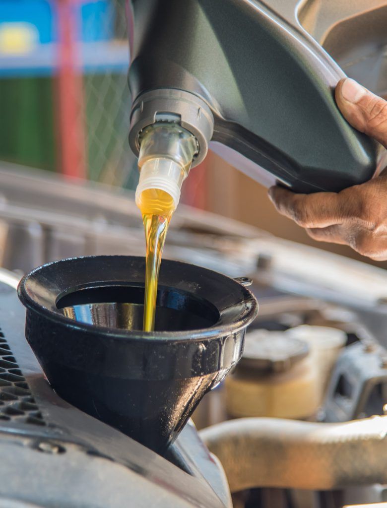 Engine being poured into a vehicle - Car Servicing Stockon-on-Tees